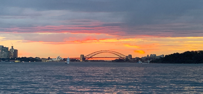 Sunset view of Sydney Harbour Bridge from our Sensational Sydney Cruise