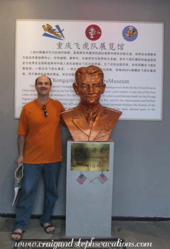 Craig with a bust of Lt. Gen. Claire Lee Chennault at the Flying Tigers Exhibition Hall