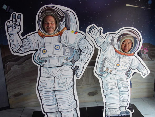Craig and Sonam as astronauts in the planetarium