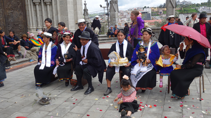 Members of the indigenous community of Pueblo Saraguro gather to perform pre-Columbian rituals following Mass at the basilica
