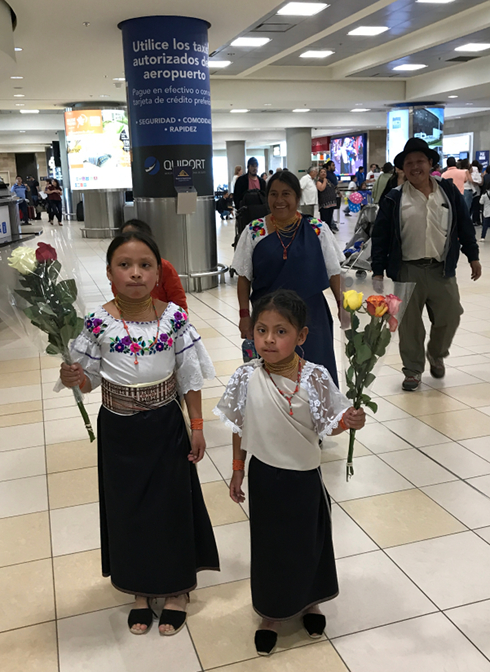 Sisa and Shina greet us with roses at the airport