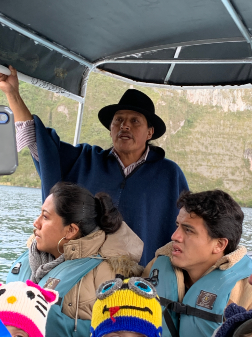 Antonio guiding a boat tour at Lago Cuicocha