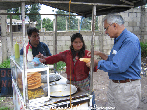 Mukul samples a chicherina  from a food cart