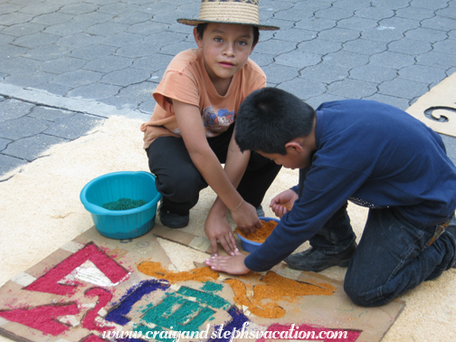 Boys help to make an alfombra, San Juan la Laguna