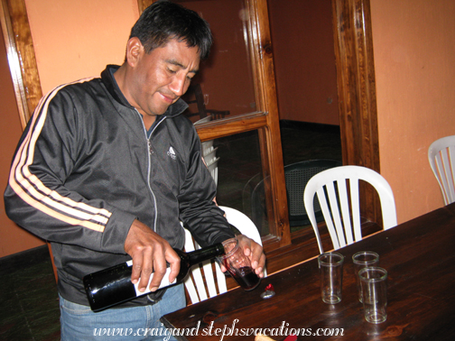 Humberto pours some wine