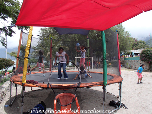 Aracely, Yasmin, Yoselin, and Eddy on the trampoline