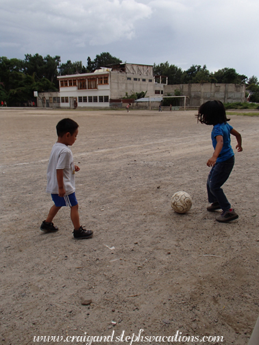 Eddy and Aracely play soccer