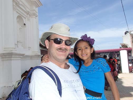 Craig and Aracely in front of the church