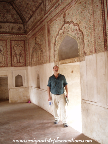 Craig stands beneath paintings in Raja Mahal