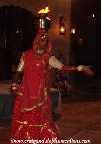 Rajasthani dancer balances a flaming urn on her head