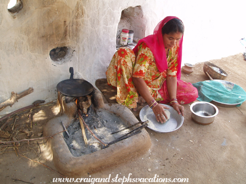 Bishnoi woman preparing bajara-ki-roti (millet flatbread)