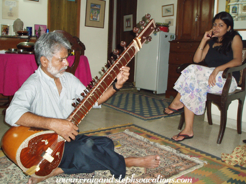 Jagdish Ji plays the sitar while Cheena looks on