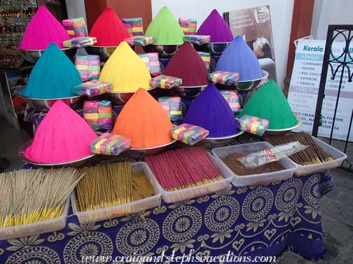 colorful kum-kum powder and incense
