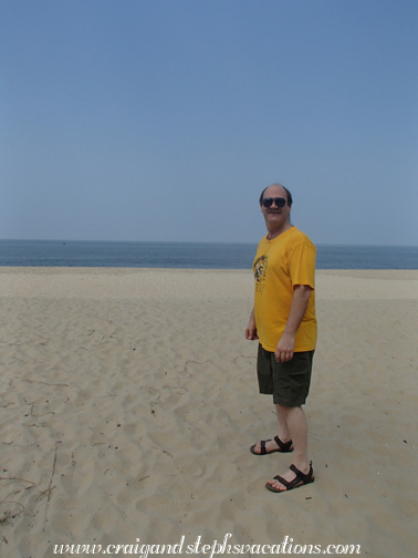 Craig walking on the beach