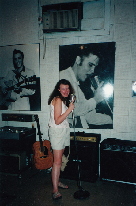 Steph posing with Elvis' microphone at Sun Studios (see Elvis pictured with same mic in the background)