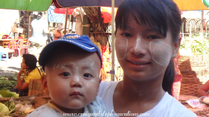 Mother and son wearing thanaka paste to protect them from the sun