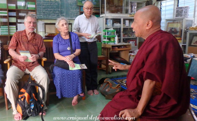 Dharamsala the monk greets us at Chanmyay Yeiktha Meditation Centre