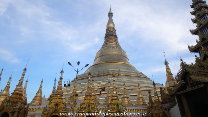 Monks walk on the octagonal ridges of Shwedagon Pagoda looking for gems displaced by birds