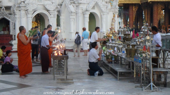 People make offerings at the Wish Fulfilling Place, Shwedagon Pagoda
