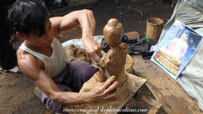 Craftsman forms a clay model for a bronze Buddha, Myanmar Muh Mandalay