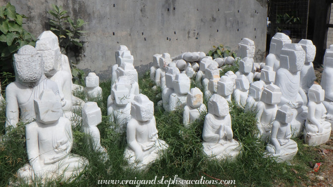 Marble Buddhas await their faces