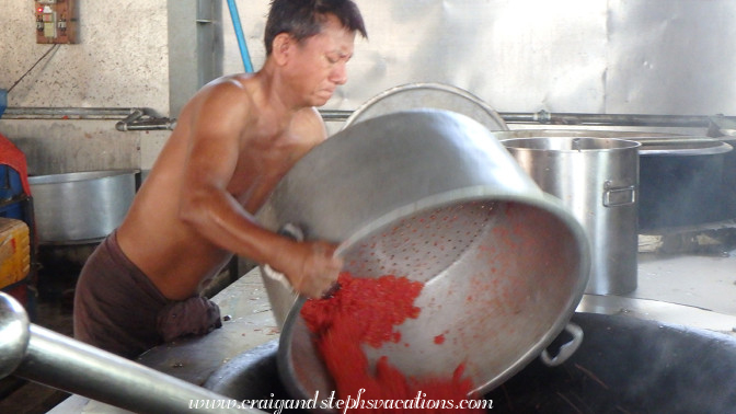 Volunteers prepare food for the monks at Mahagandayon Monastery