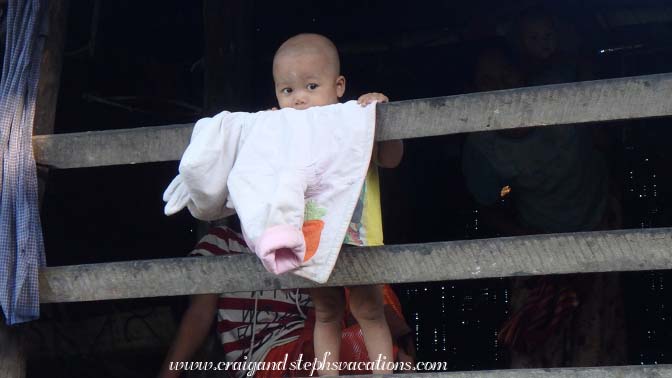 Baby watches us from his balcony, Sa Pa Kyi Village