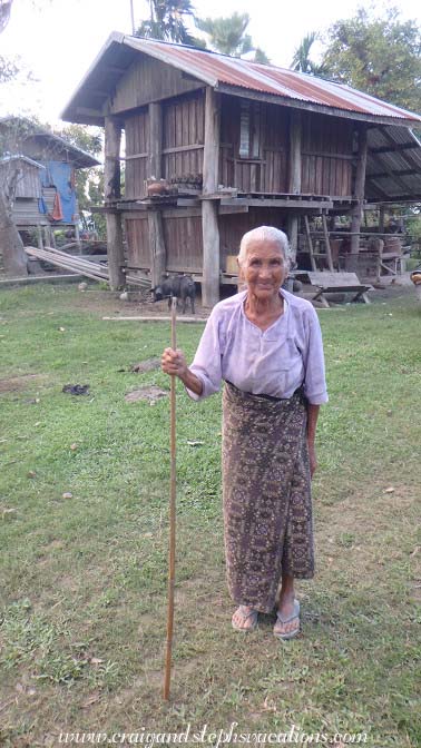 Elderly woman who appreciated our local dress and placed her hand over her heart, Tha Phan Seit Village