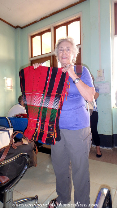 Esther buys a Naga blanket near the airport