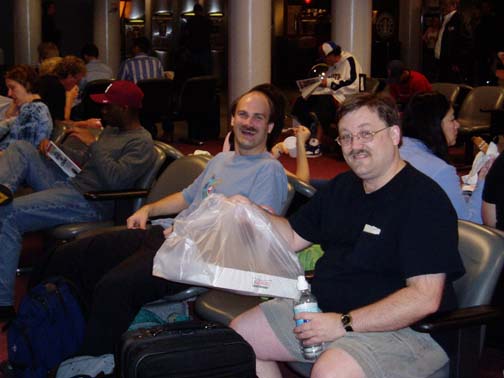 Craig and Steve at Logan airport, Krispy Kremes in hand