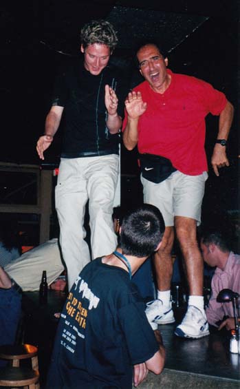 Adam Wakeman and Tony Fernandez dance on the bar at Embuscade