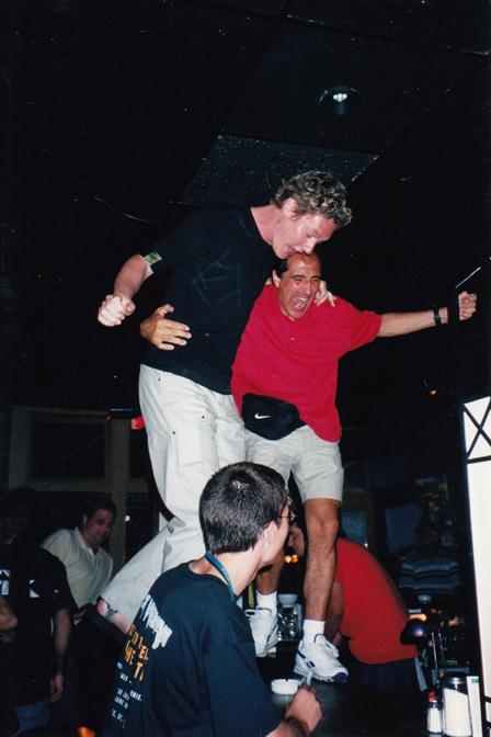 Adam Wakeman and Tony Fernandez dance on the bar at Embuscade