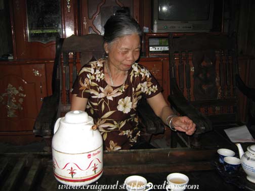 Chuong's mother pours us tea