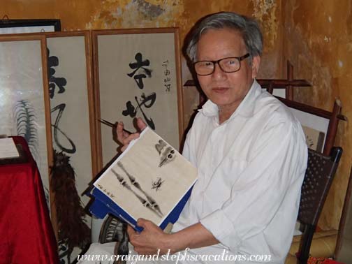Artist demonstrating painting and calligraphy
