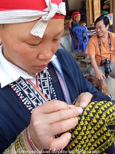 Red Dao woman demonstrating their intricate embroidery