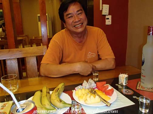 Cuong eating dessert at the Bordeaux Hotel
