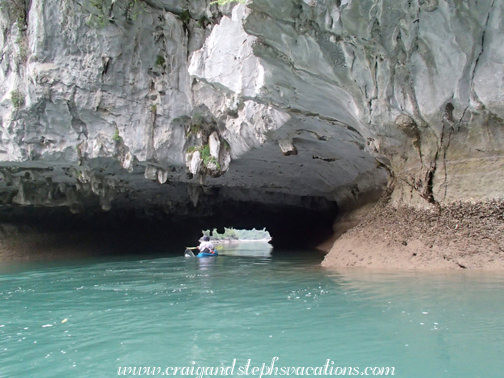Cuong enters a cave in his kayak
