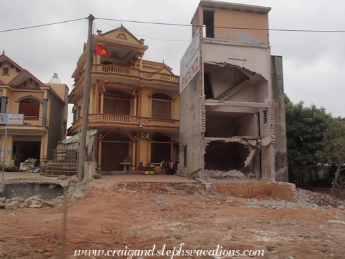 Houses in Halong City being cut in half by road construction
