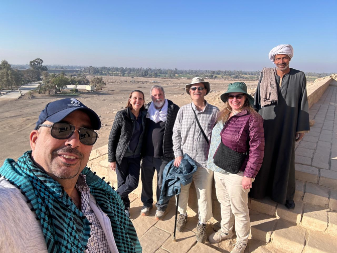 Amr, Jenn, Mark, Craig, and I with the caretaker at El Kab tombs