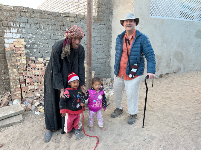 Toddlers welcome us to the home of Abd Elreheem at Bisaw Village