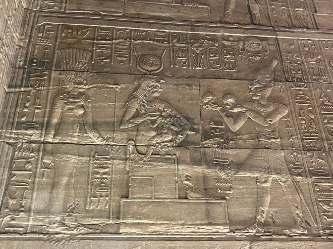 Raised relief carving of Isis suckling Horus at Philae Temple