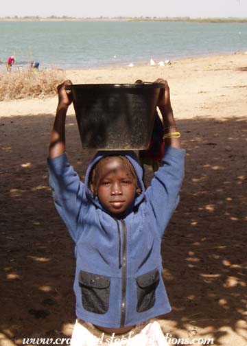 Little girl with bucket, Segoukoro