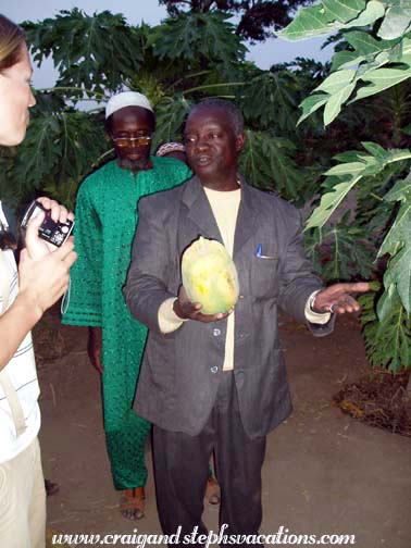 Timothee buys the ceremonial first papaya