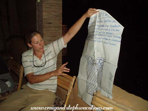 Anna teaches us how to plant the seedlings over dinner at La Falaise