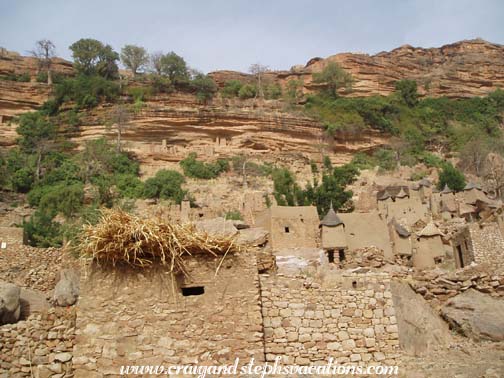 Dogon village with Tellem cliff dwellings above