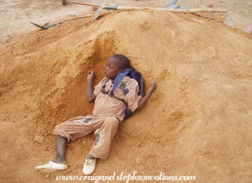 Child plays in the dirt pile