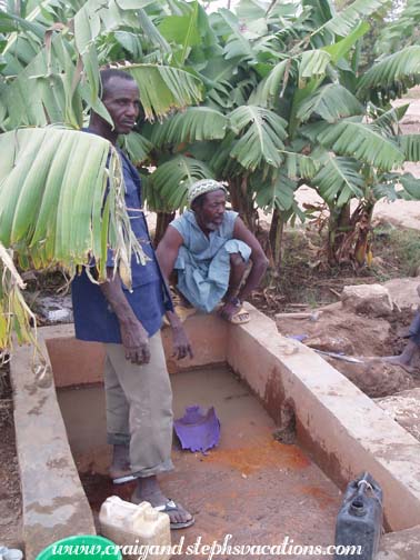 Village men at the existing water basin