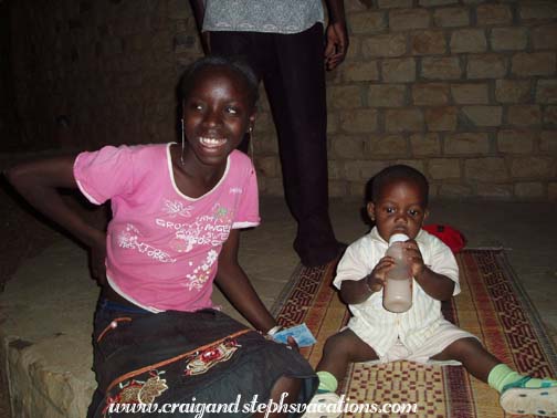 Postcard seller and baby