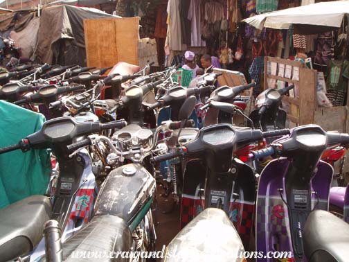 Motor scooters parked outside the Pink Market