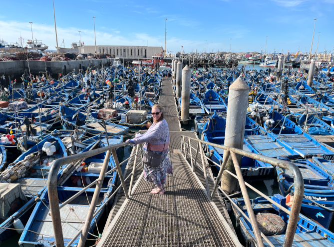 Steph among fishing boats at the port